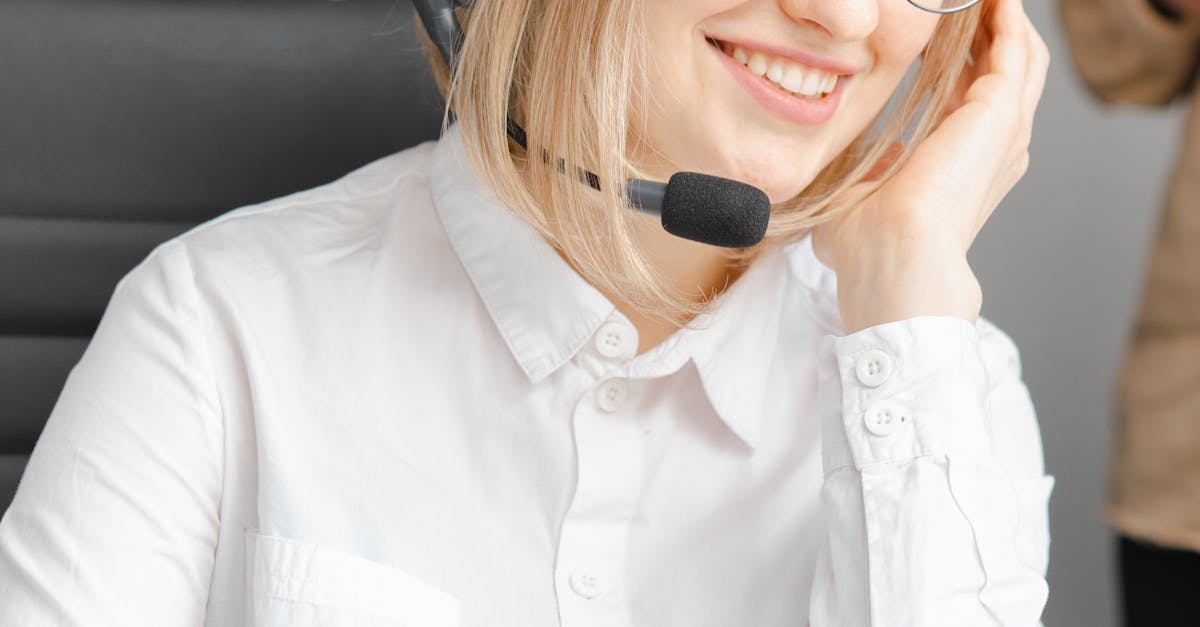 Photo by Mikhail Nilov Professional woman in headset offering customer support at a call center.