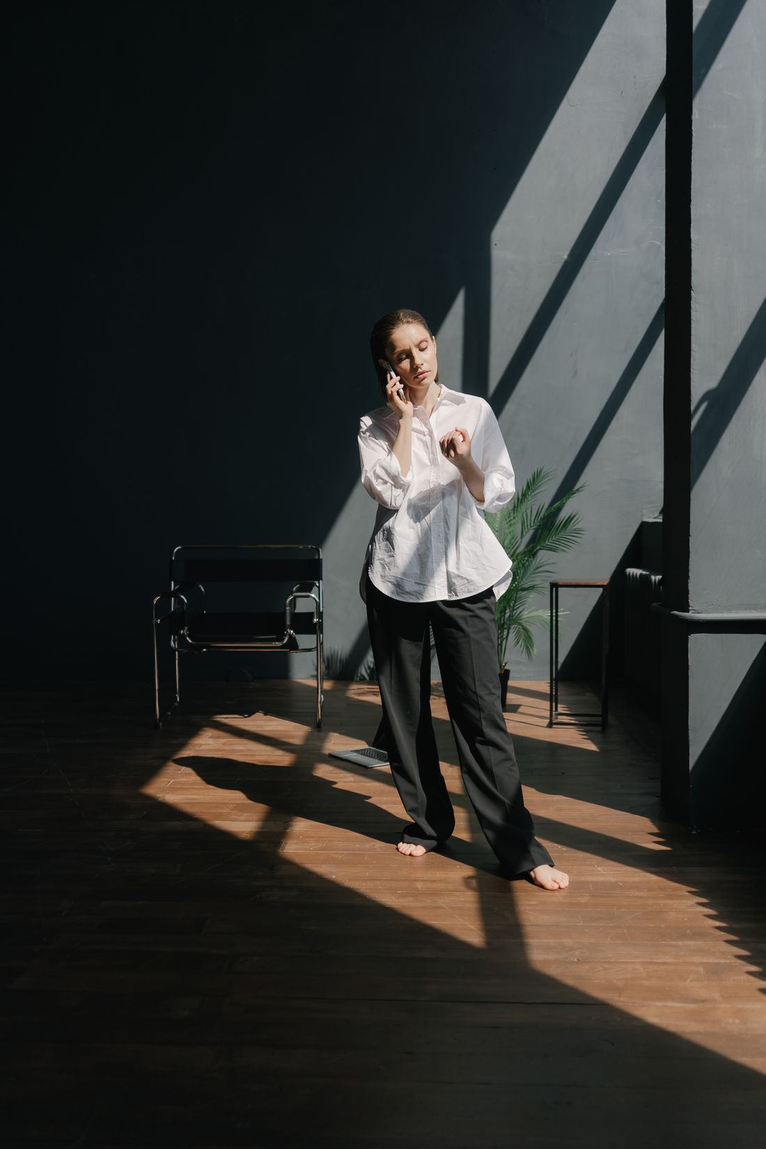 Businesswoman taking a phone call in a modern office