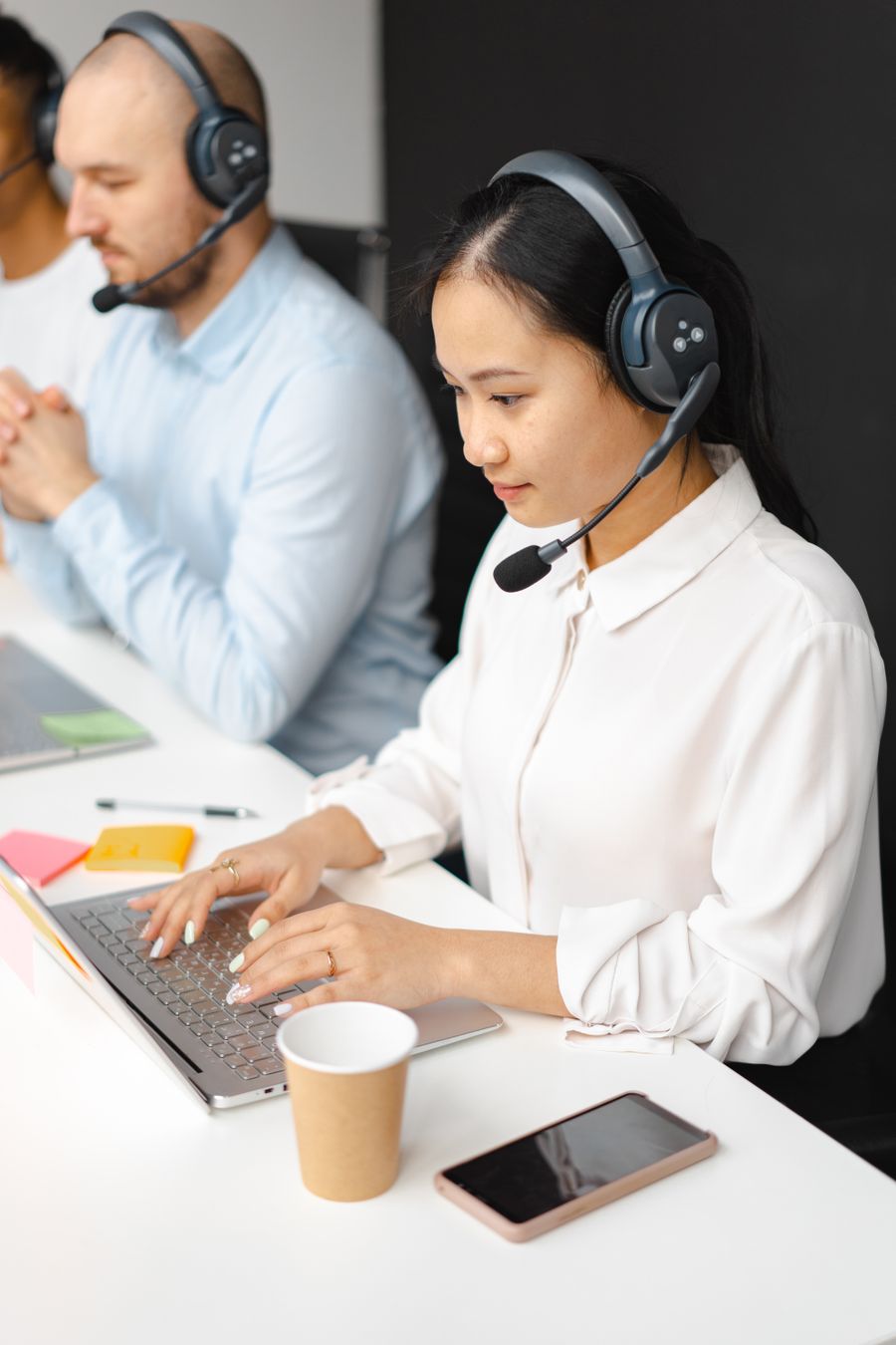 Support team working together in a customer service office