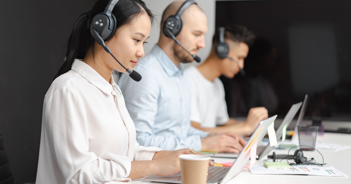 Remote customer support agent handling live chat inquiries from a modern workspace