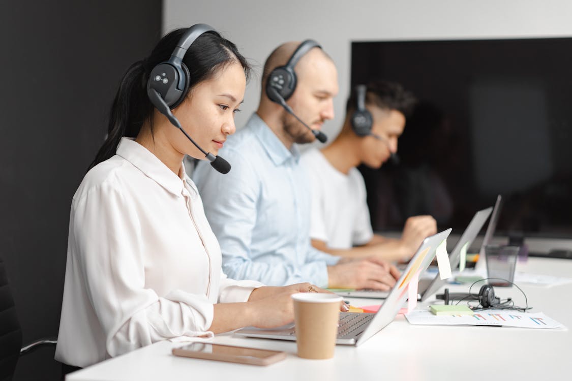 Free Shallow Focus of Woman Working in a Call Center Stock Photo