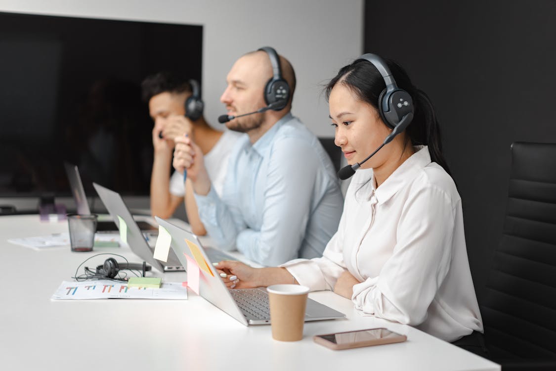 Free People Working in a Call Center Stock Photo