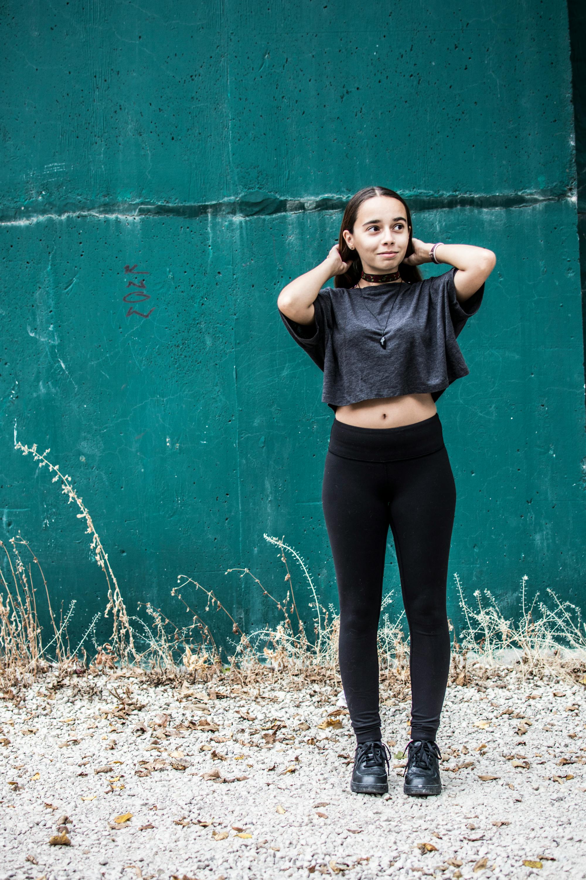Wearing Black Crew-neck and Black High-waist Fitted Leggings · Stock Photo