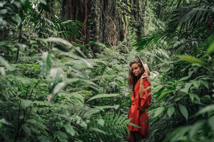 Woman In Robe Standing In The Forest