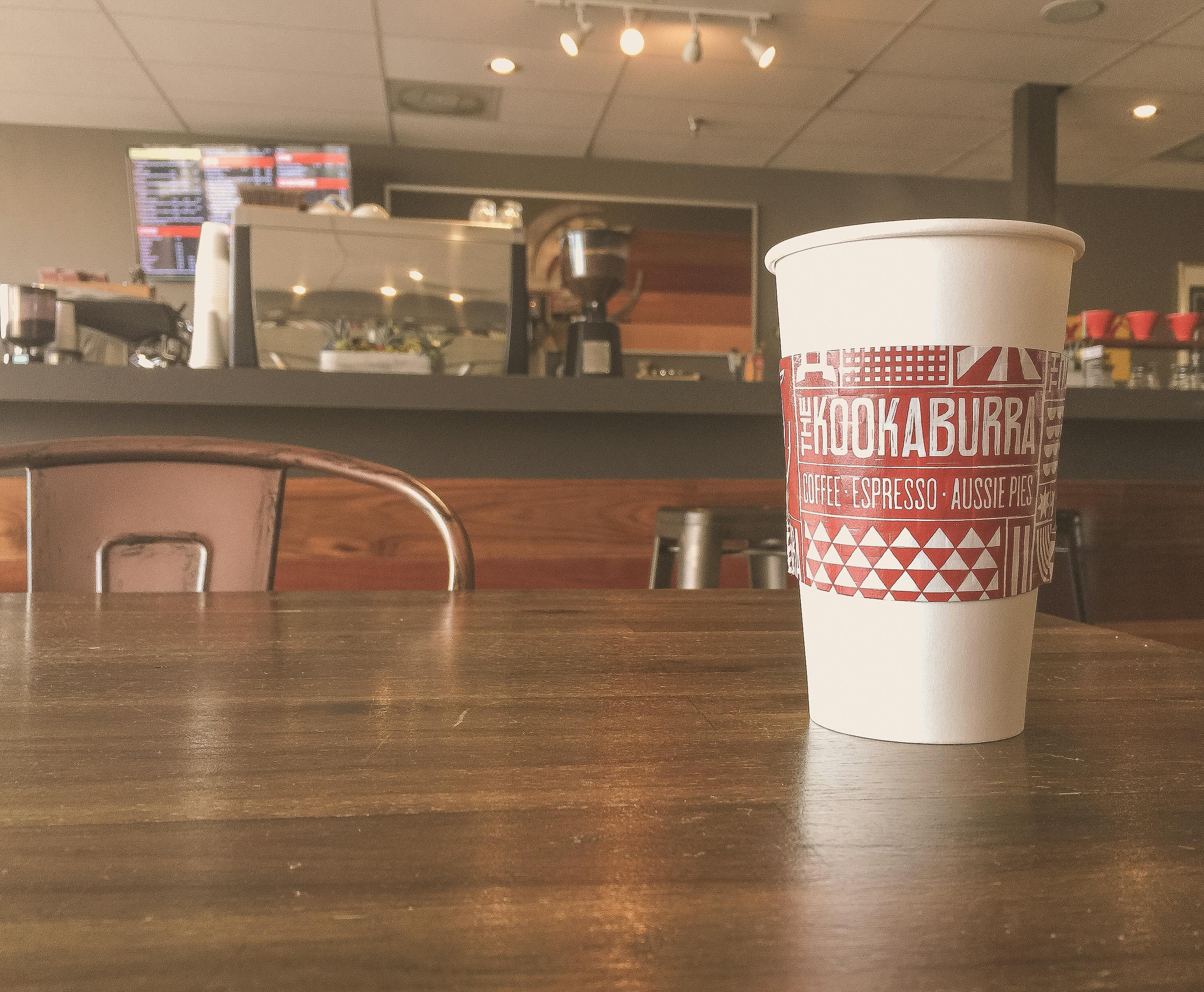 A group of students sitting in a classroom, looking concerned.