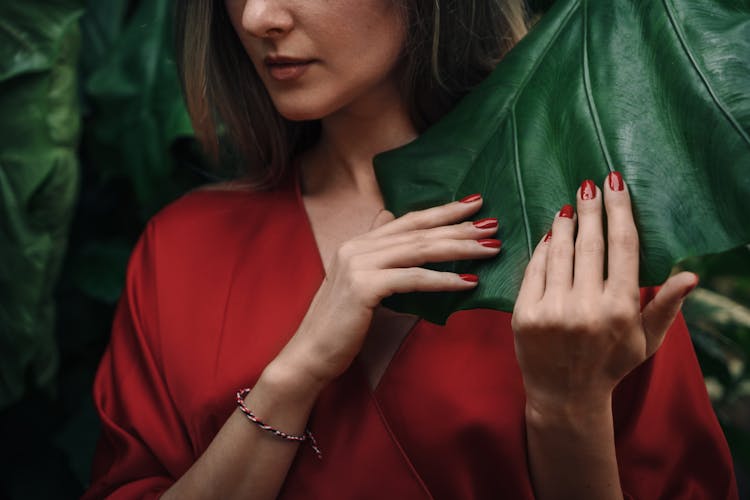 Woman With Red Nails Wearing Red Top 