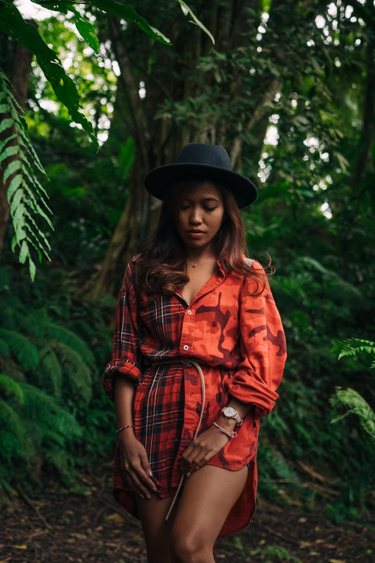 Woman Wearing Black Hat Standing Near Trees