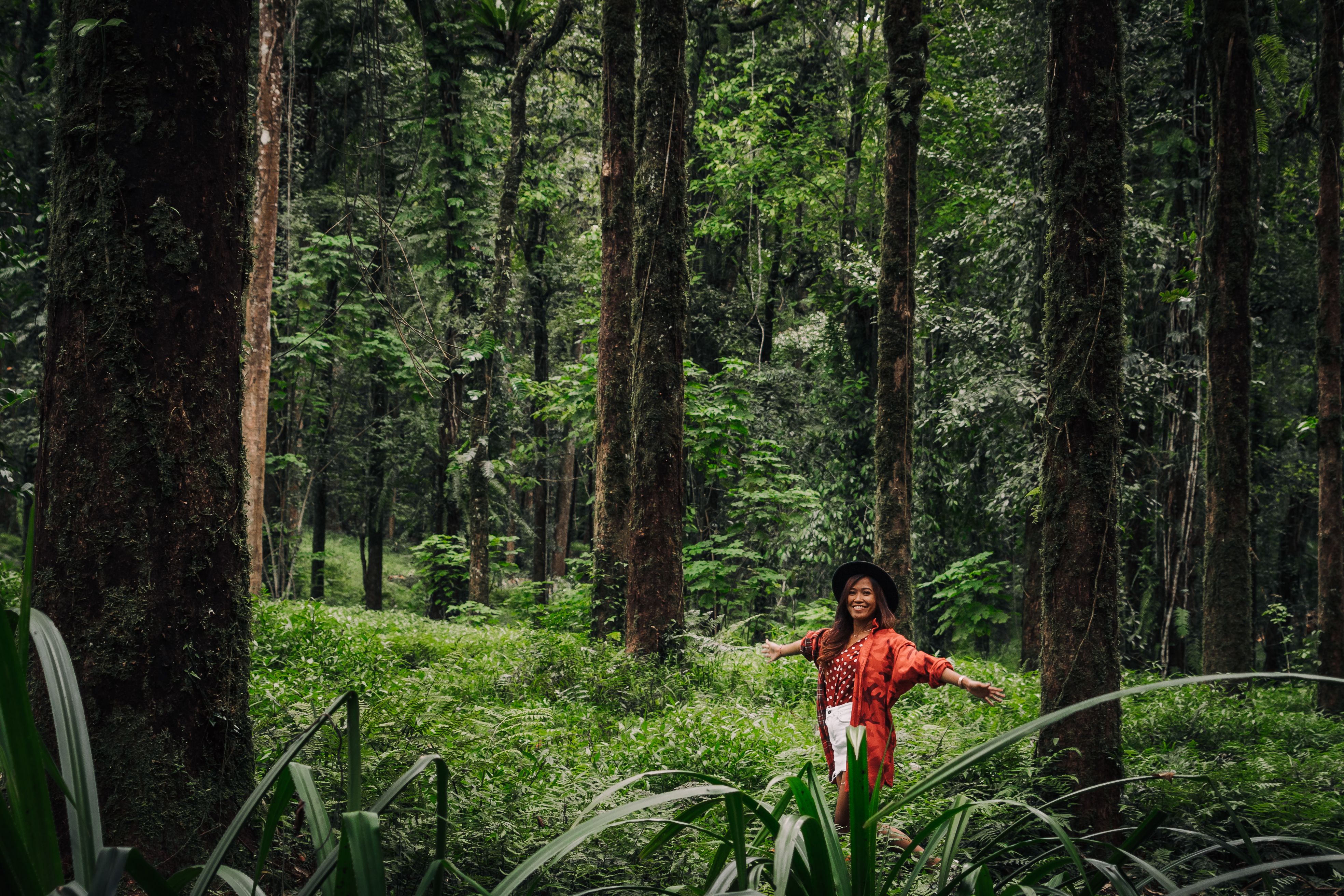 Woman in Red Long Sleeves Posing in the Forest · Free Stock Photo