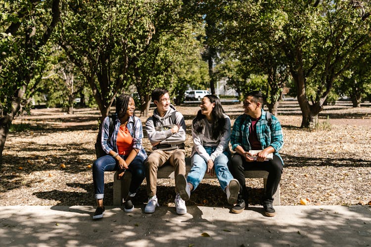 Friends Sitting On A Bench