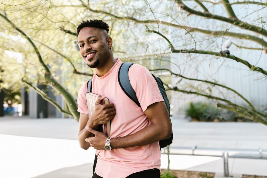Student reading on campus