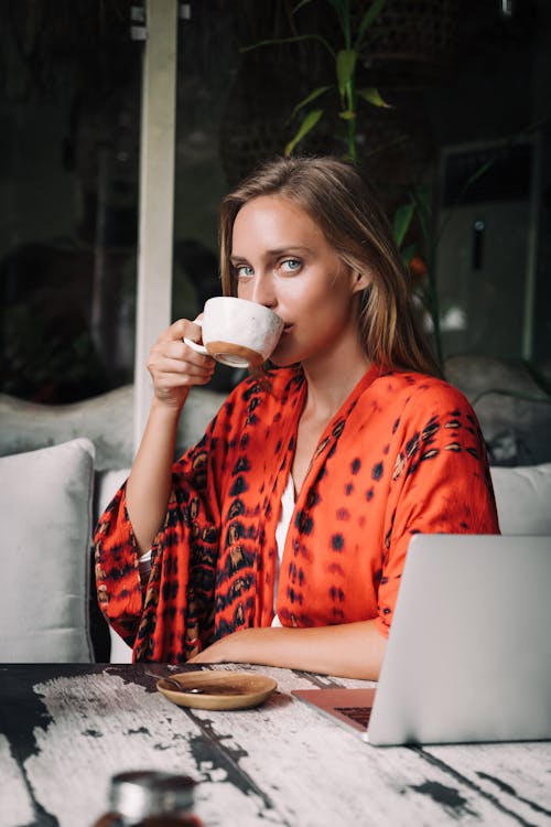 Free Woman Drinking from a Cup Stock Photo