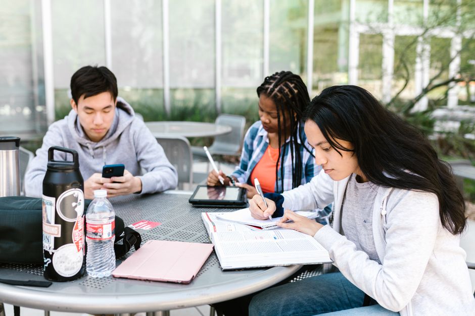 full|student studying with AI tablet