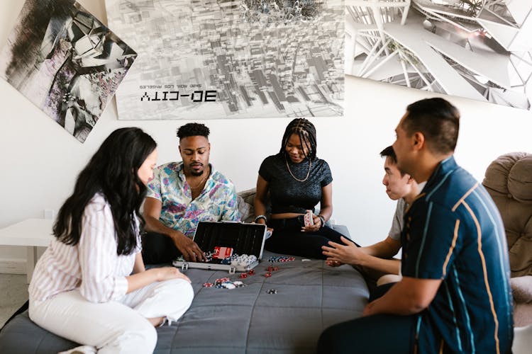 People In The Bedroom Playing Poker Game