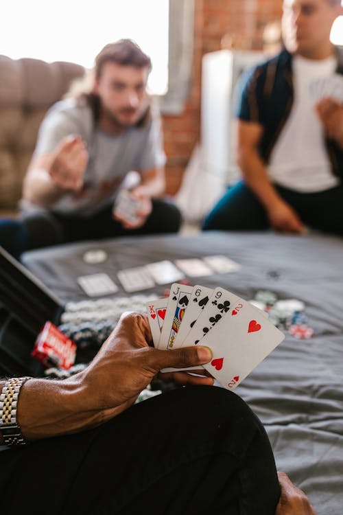 Person Holding Playing Cards