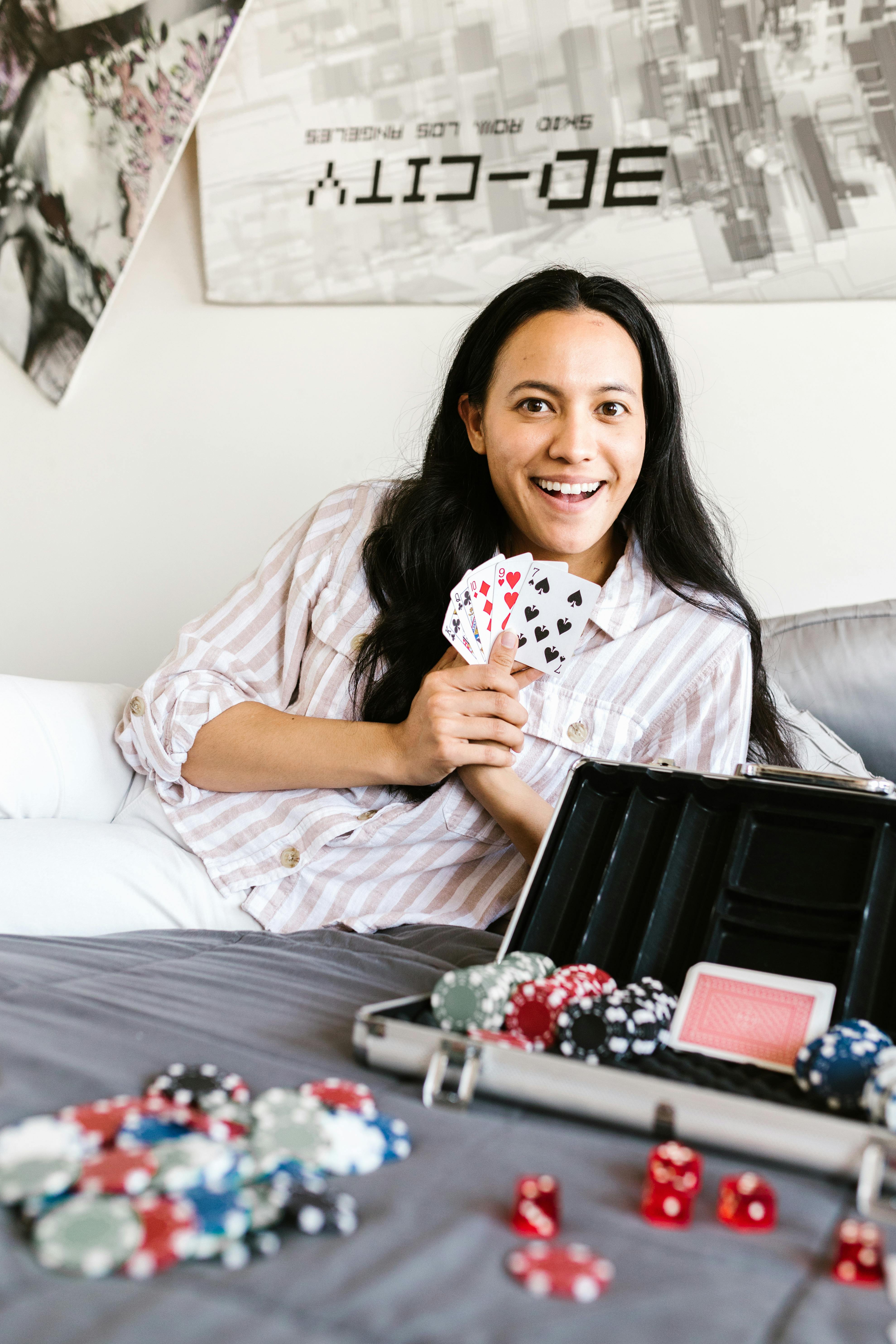 woman holding playing cards