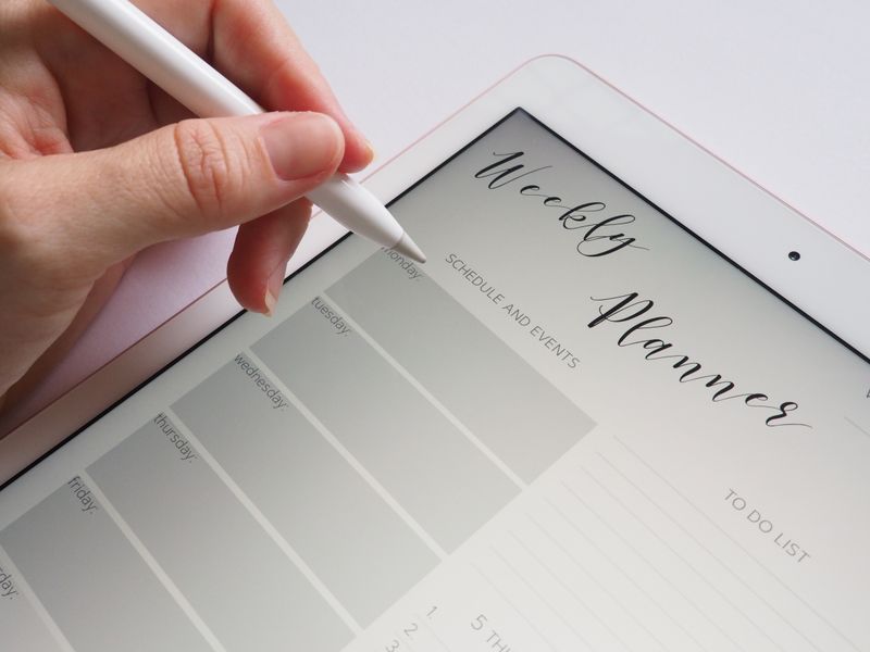 ipad showing planner app split screen with a browser