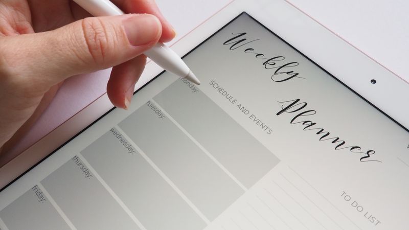 Writer working at a desk with writing assistant tools