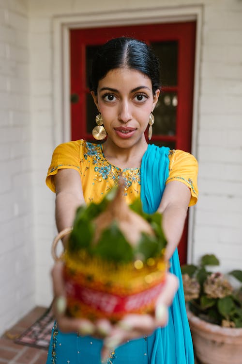 Pretty Woman Holding a Kalash