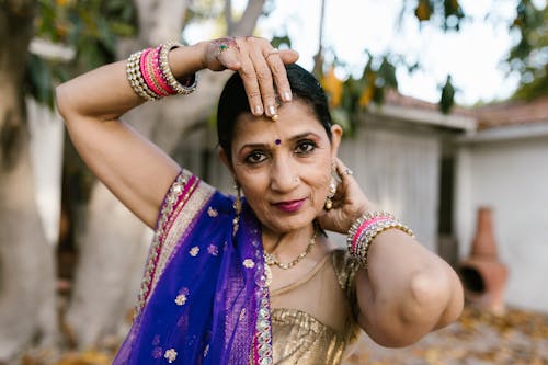 A Woman Wearing Accessories and a Saree