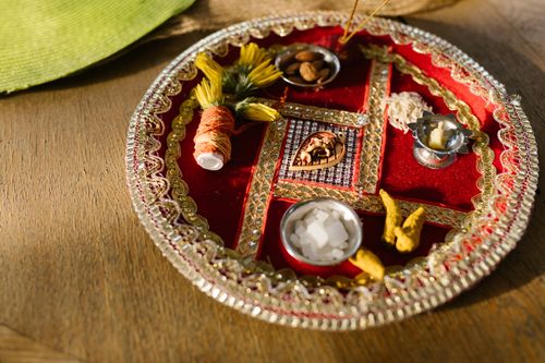 Free A colorful and ornate Indian puja thali set for Diwali rituals, depicting cultural tradition. Stock Photo