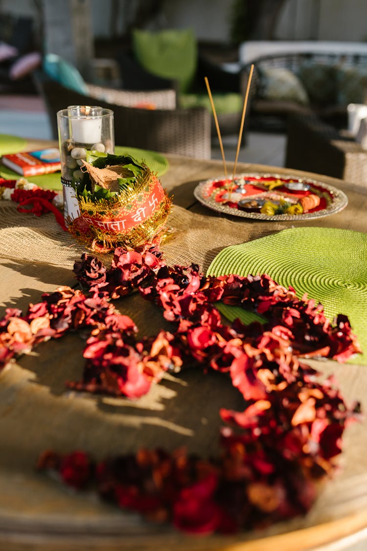 Flower Petals And Diwali Ornaments On A Table