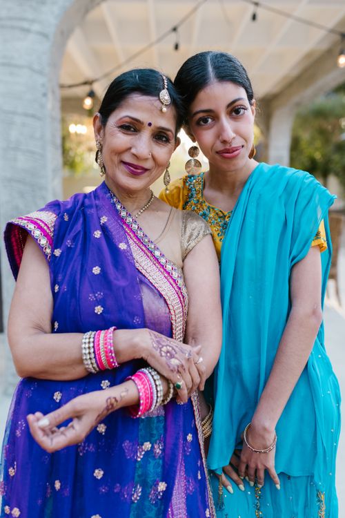 Free Two Indian women wearing traditional sarees and jewelry showcase cultural elegance and bonding. Stock Photo