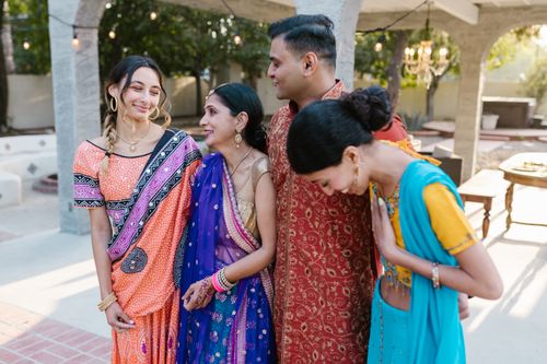 Free Group of people joyfully celebrating outdoors in vibrant traditional Indian clothing. Stock Photo