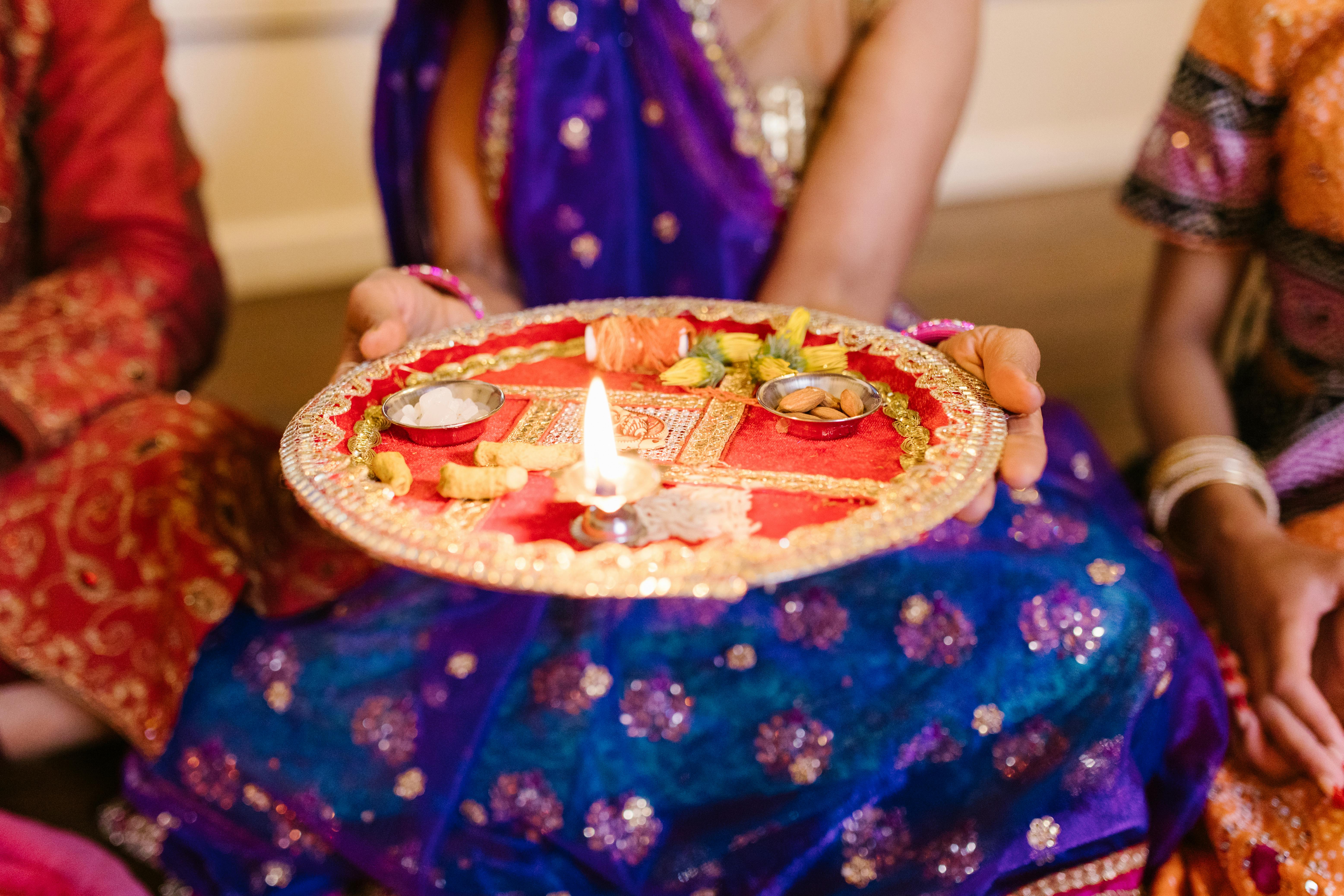 A Woman Holding A Puja Thali · Free Stock Photo