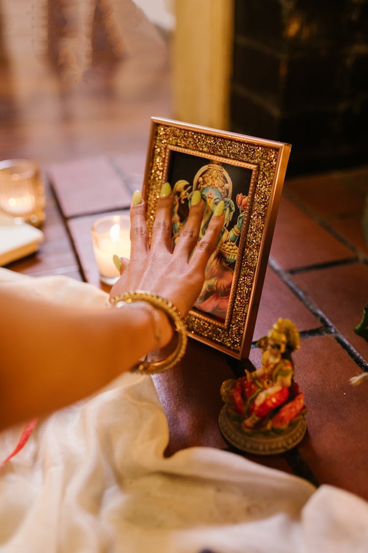 Woman Touching A Traditional Picture