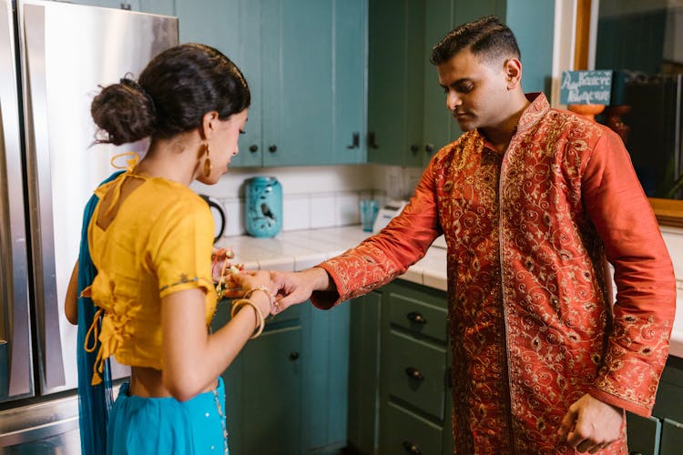 Traditional Indian Couple In A Kitchen