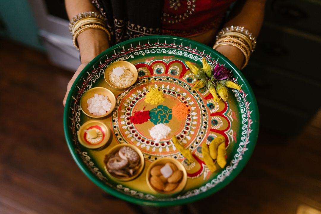 Gujarat's Contribution to India's Food Identity: A Story Worth Telling on Independence Day 1 Overhead view of a traditional Gujarati thali with multiple small bowls arranged on a round steel plate