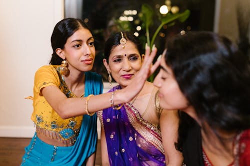 Close-Up Shot of Three Women in Traditional Clothing