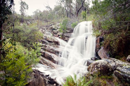 Free Beautiful waterfall cascading over rock formations in Halls Gap, Australia. Stock Photo