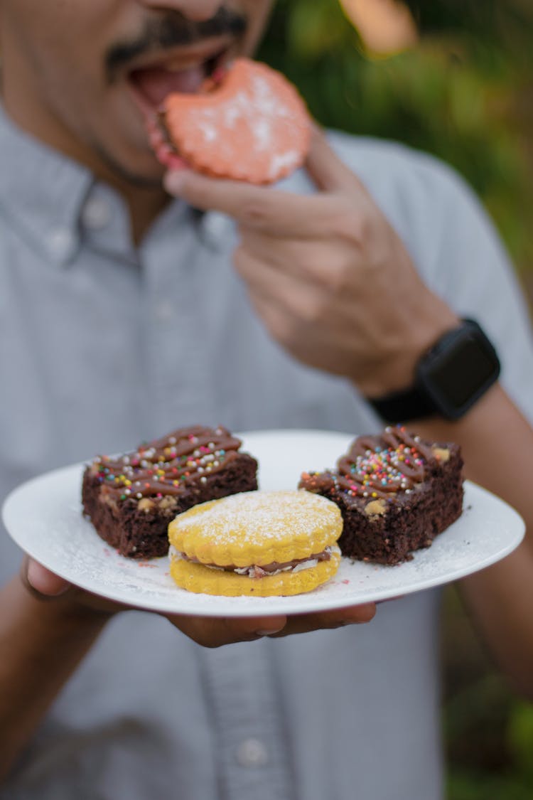 A Plate With A Cookie And Brownies