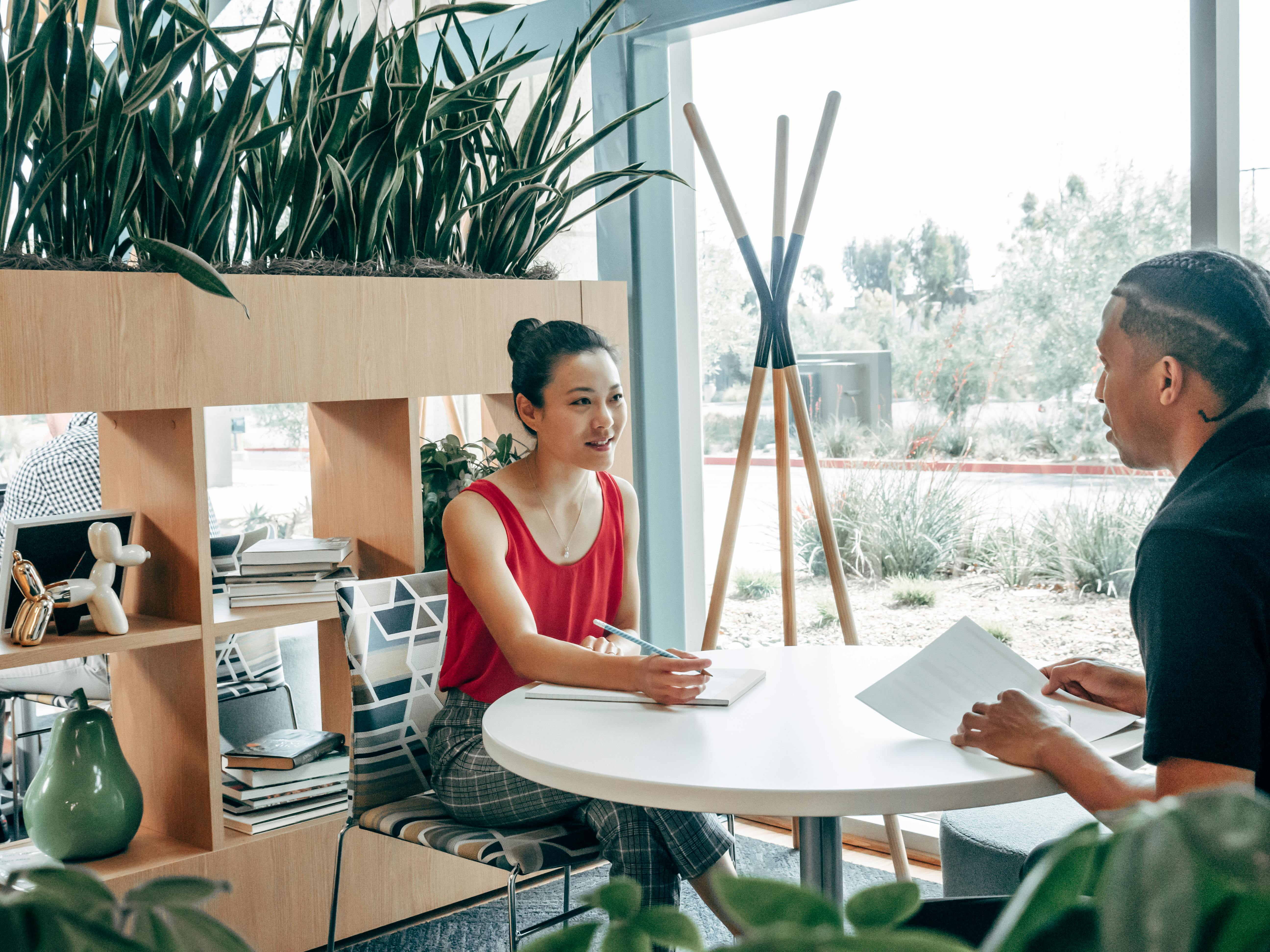 Free Man and Woman Sitting at the Table Stock Photo