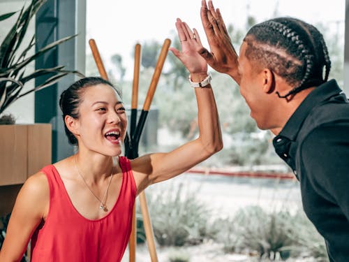 Man and Woman High Fiving