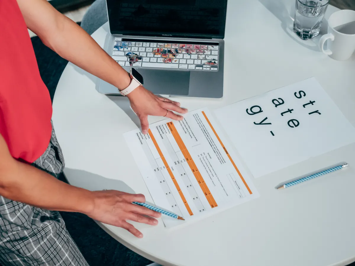 Person reviewing content strategy results and ROI data for an AI SEO blog writer project.