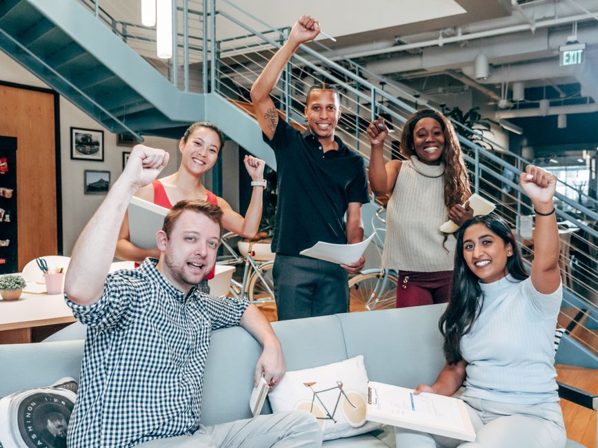 Group of people inside a building at a pitch event - Investor pitch events Group of people inside a building at a pitch event - Investor pitch events