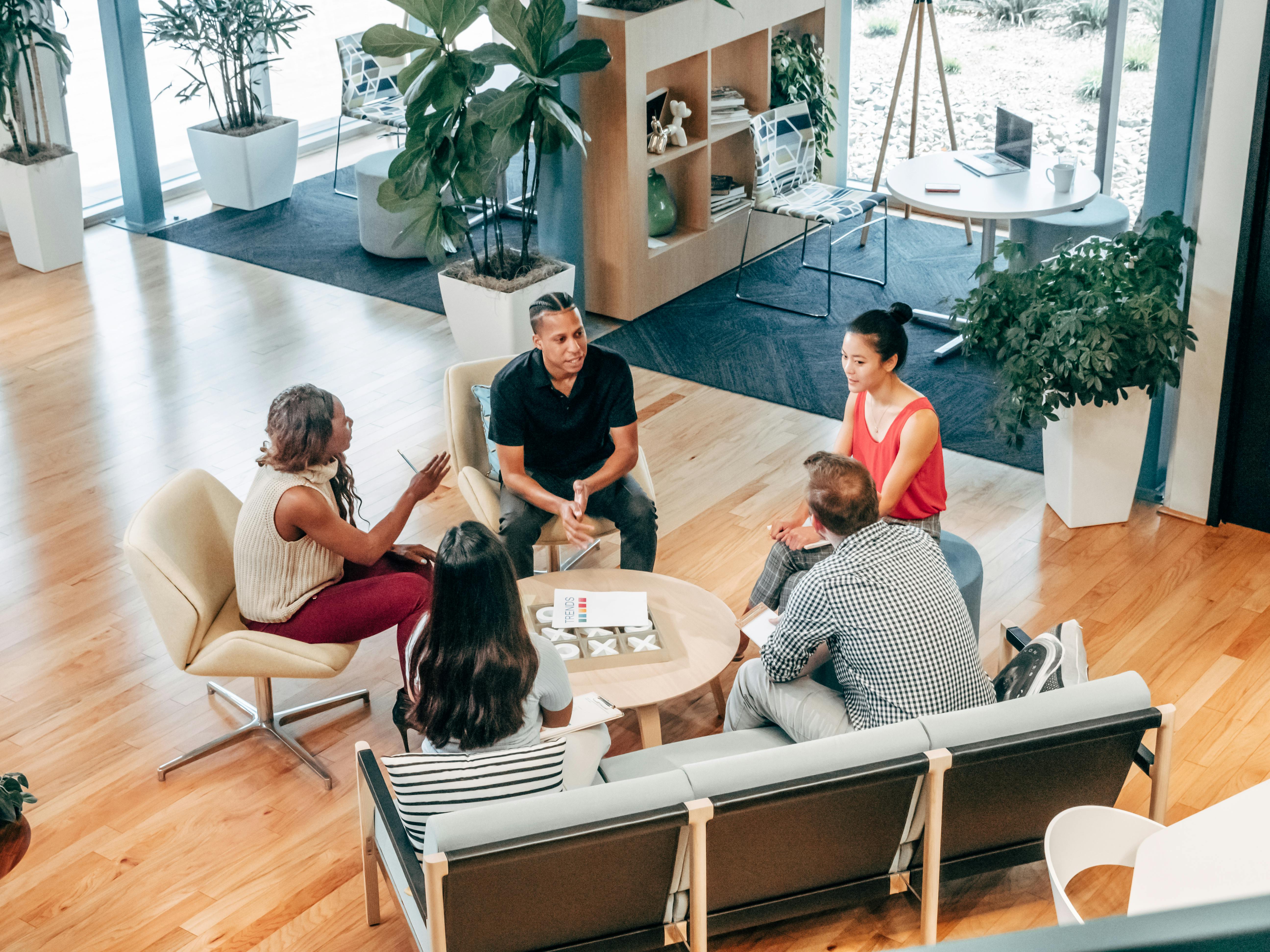 people sitting on chair in front of table