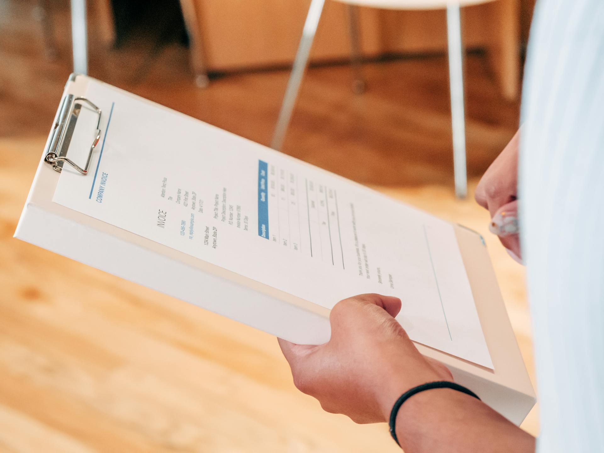 Person Holding White Printer Paper