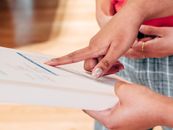 Person Holding White Printer Paper