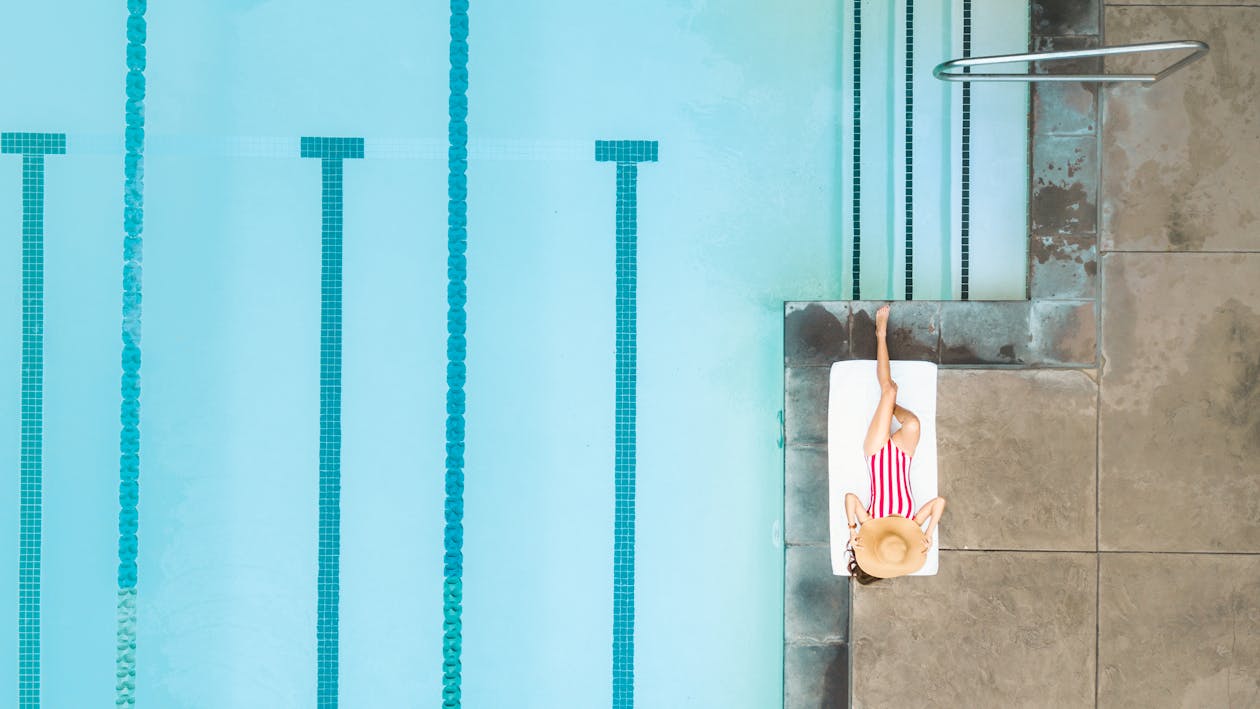 Person focused while working on a laptop with headphones