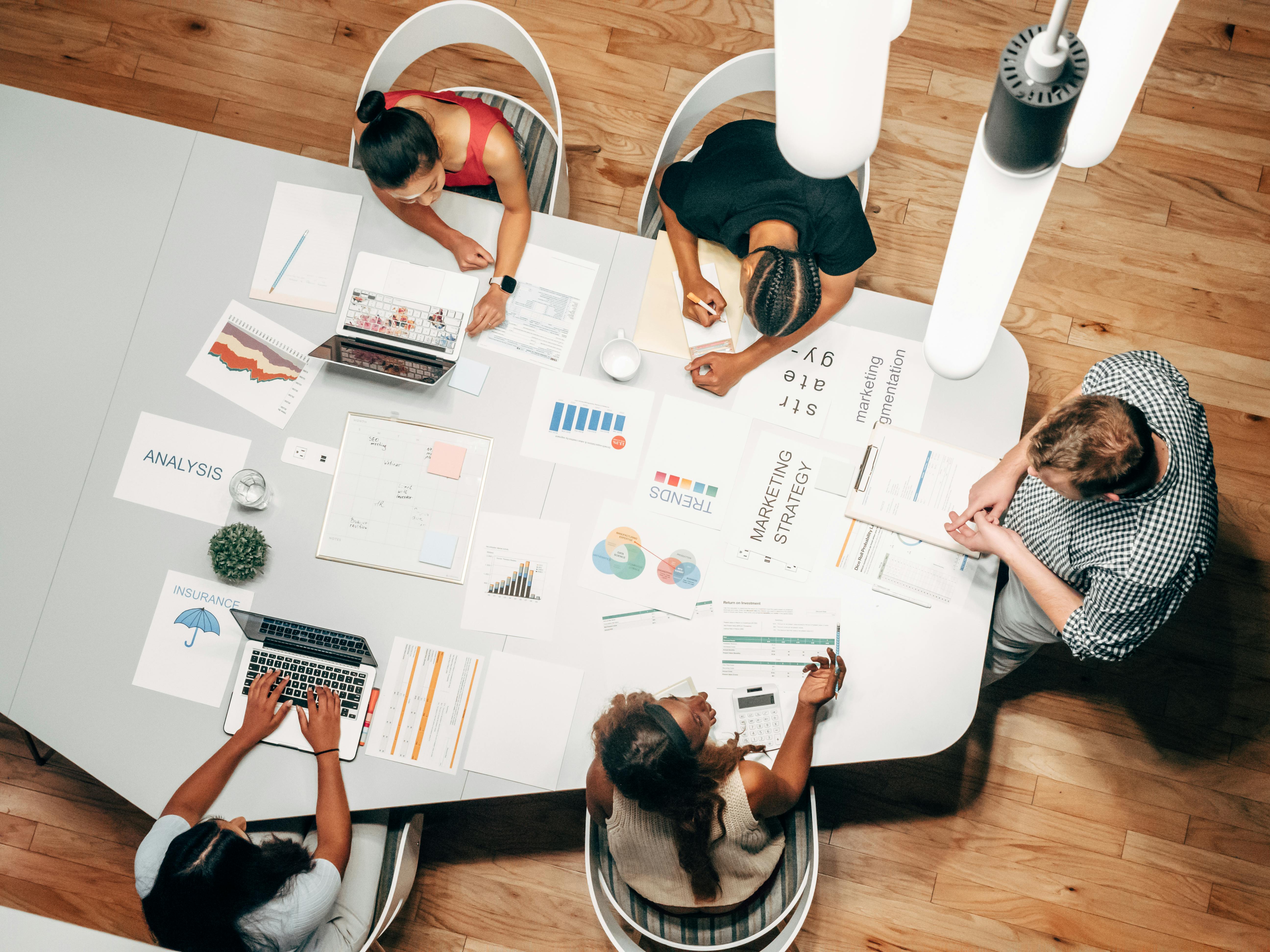 Free Overhead Shot of People in a Meeting Stock Photo