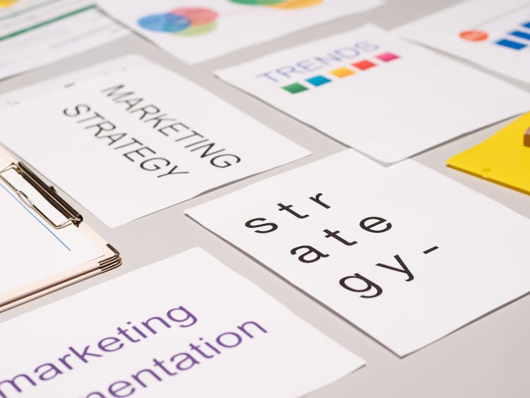 Paper Cards About Marketing On Desk