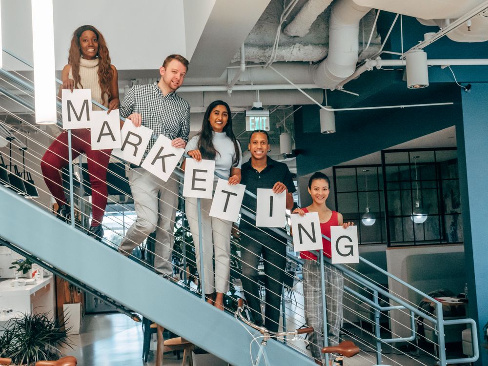 Free Coworkers Standing on a Stairway Stock Photo