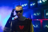 A Man with a Prosthetic Arm Wearing Black Sunglasses