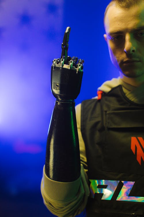 A Man with a Prosthetic Arm with His Middle Finger Up