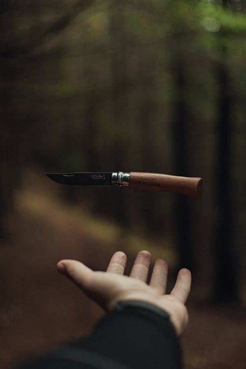 Free A Person Catching a Knife Stock Photo
