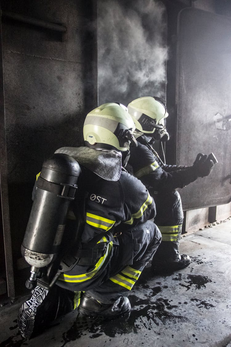 Firefighters At The Doorway