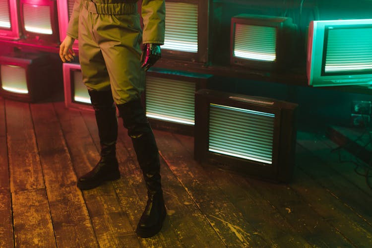 Woman In Front Of Vintage TVs